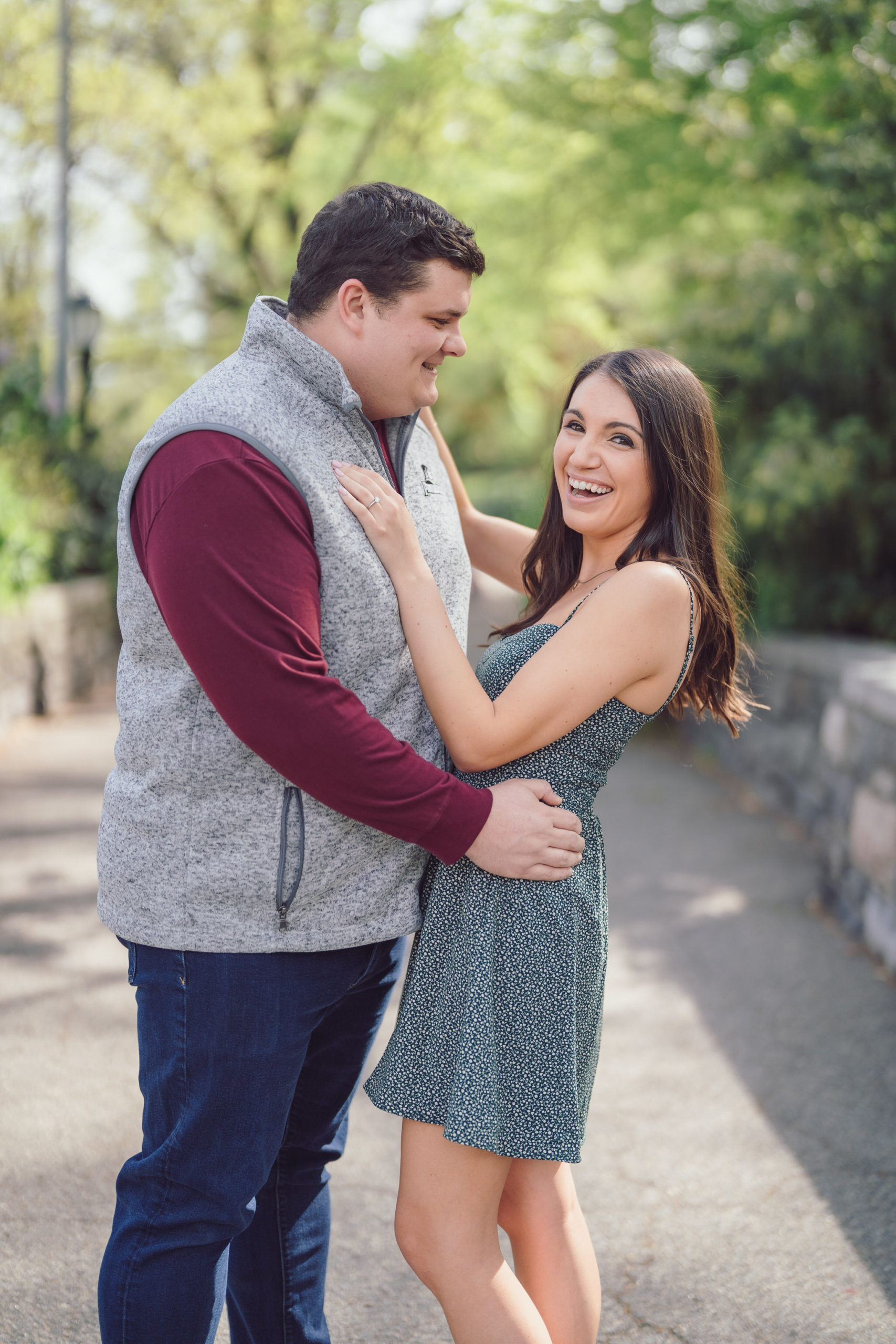 a couple laughing at each other's jokes during engagement session